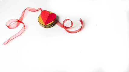Valentine, handmade heart on wood with ribbons. isolated white background

