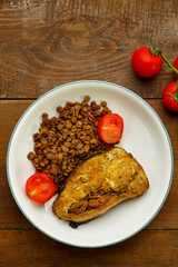 Baked cod with lentils and cherry tomatoes.