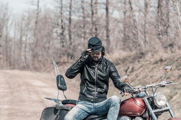 Biker portrait. Photo with a motorcycle
