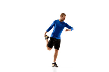 Plakat Prepares. Caucasian professional jogger, runner training isolated on white studio background. Muscular, sportive man, emotional. Concept of action, motion, youth, healthy lifestyle. Copyspace for ad.