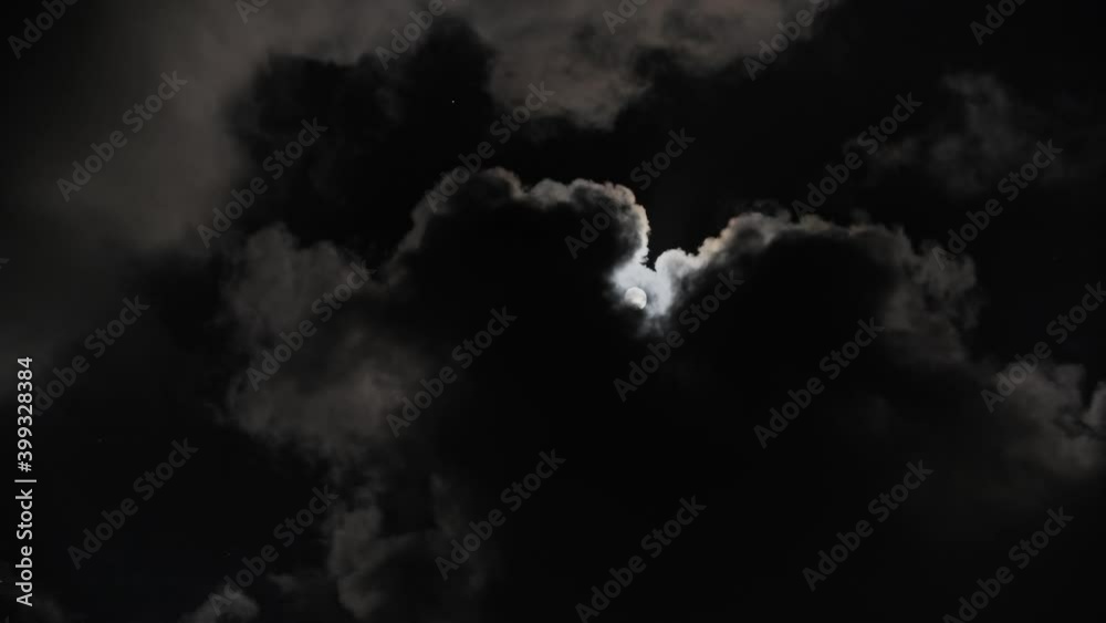 Wall mural full moon moving between clouds, 4k