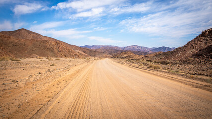 Fototapeta na wymiar Gravel road from Ai-Ais to Aus in Richtersveld Transfrontier Park, Namibia.