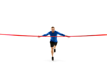 Champion. Caucasian professional jogger, runner training isolated on white studio background. Muscular, sportive man, emotional. Concept of action, motion, youth, healthy lifestyle. Copyspace for ad.