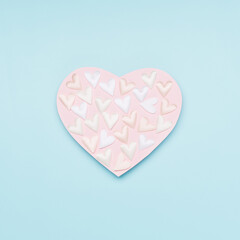 Pink white textile hearts on pastel blue background. Valentines day concept. Flat lay, top view, copy space.