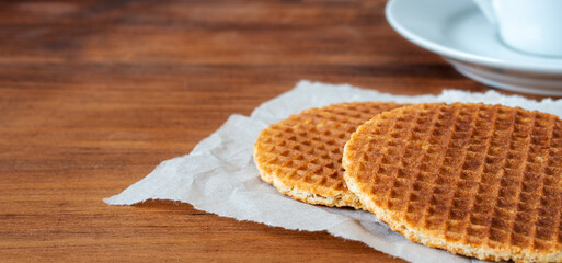 Traditional local signature authentic Dutch Netherlands sweet fresh homemade of delicious tasty stack brown golden waffle caramel honey sugar syrup for dessert in cafe with coffee tea call Stroopwafel
