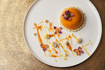 Orange cake with cream on white plate
