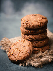 Cookies with hazelnuts and chocolate, dark moody sweets, empty copy space for text