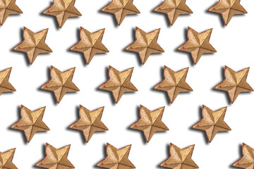 Obraz premium Gold Christmas decorations, gold star on a white background. Flat lay, top view. Christmas pattern