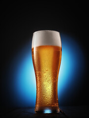 Glass of beer on blue background