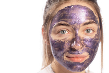 Pore cleansing mask on the face of a young attractive woman.