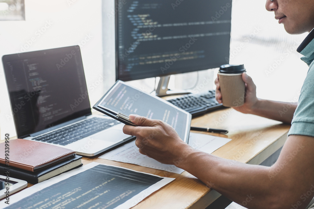 Aufkleber Young Professional programmer working at developing programming and website working in a software develop company office, writing codes and typing data code, Programming with HTML, PHP and javascript