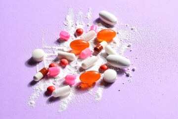 group of pills with spilled powder