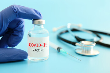 Fototapeta premium Doctor or nurse holding covid 19 vaccine. Healthcare and Medical concept