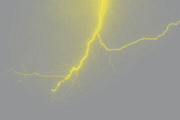 Bright lightning in night sky. Trendy colors of the year 2021 - illuminating and ultimate gray. Toned image