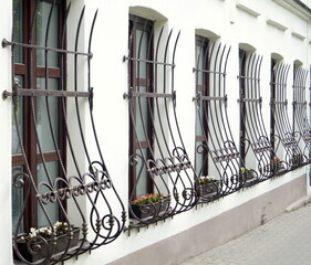 Forged window rails on the central old tourist street of Minsk (Belarus)