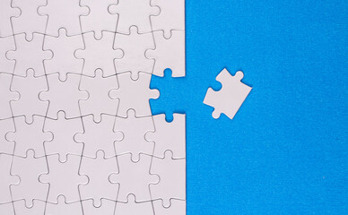 Puzzle pieces on blue background