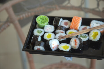 sushi with sticks on the table