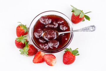 Bowl of strawberry jam isolated on white background from top view