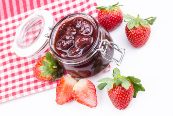 Bowl of strawberry jam isolated on white background from top view
