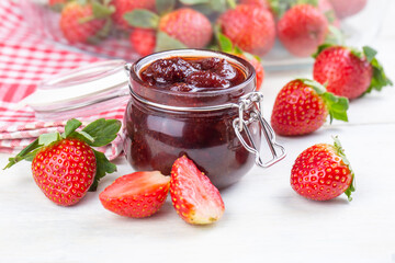 Bowl of strawberry jam isolated on white background from top view