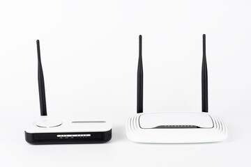 Two wifi routers, wireless devices with one and two antennas on white background.