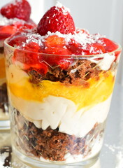 Mini cakes with cream in cups. Home cooking.
