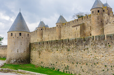 Fototapeta na wymiar Outer wall and towers of Carcassonne fortification. France.