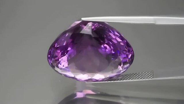 natural purple amethyst on the grey background