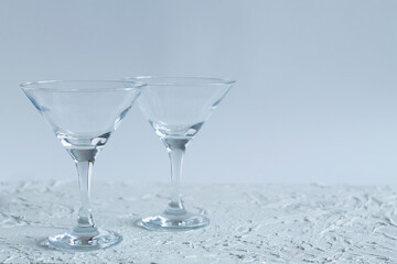 two empty martini glasses of cocktail on white background. alcohol drinks. Glasses for cocktail on the table. copy space