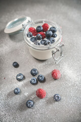 Yogurt with blueberries and raspberries, topview