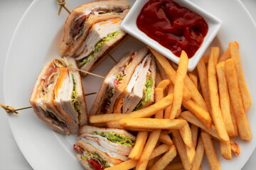 Chicken Club Sandwich With Fried Potato. Grilled Clubhouse Toast With Turkey Ham On White Plate Top...