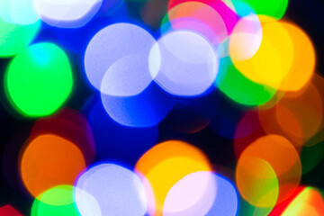 Abstract background with colourful blurred bright circles.