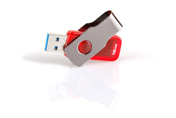 Red and silver USB 3.0 flash drive isolated on white background . USB Pen Drive or flash drive on white background. Close-up. Full depth of field.