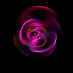 Spinning rays of light isolated on black background. Graphic 2D illustration of glowing colorful light particles in circular motion.
