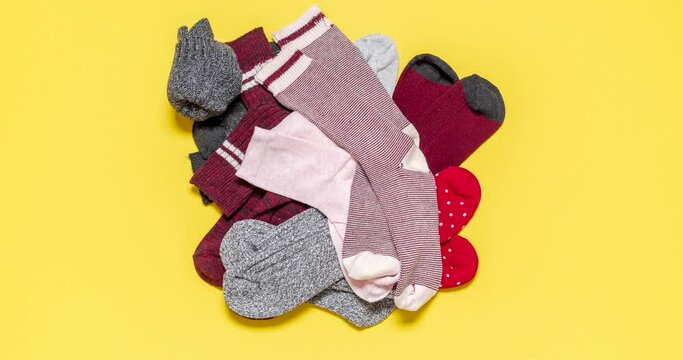 Socks in a drawer stop motion. Top view with a pile of socks.
