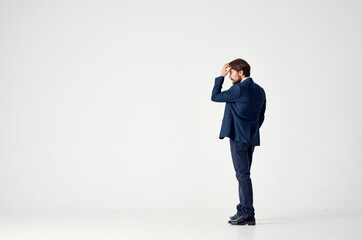 business man on a light background in a classic suit Copy Space back view