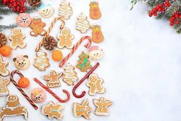 Fototapeta na wymiar Christmas new year food, traditional festive gingerbread and tangerines with fir branches, pine cones and decorations, dish design idea, background, bakery concept, selective focus,