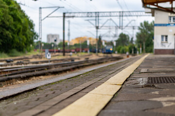 Fototapeta premium An old railway depot, trains in the background with all the infrastructure.