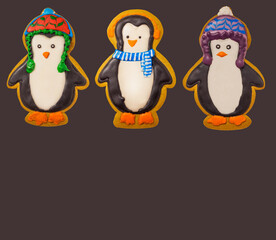 Fototapeta premium Gingerbread cookie of cute penguin on white background isolated. Traditional Christmas food. Christmas and New Year holiday concept..Hand painted. Comfort food. Christmas treat.