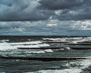 Rough sea with dark clouds and beautiful white waves.