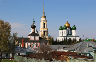 Churches and the Cathedral tower over the farmhouses. The city of Kolomna.