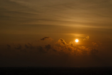 Beautiful sunset red sun over city.