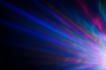 Colorful rays of light or light beams at dark. Abstract high resolution background.