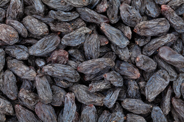 black raisins closeup texture background