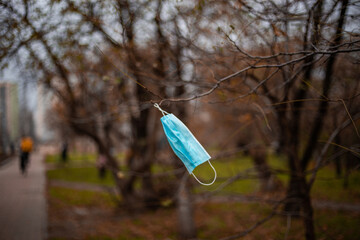 Discarded protective medical mask during the covid-19 coronavirus pandemic