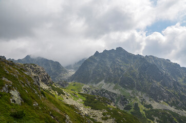High rocky peaks national park of the High Tatra mountains with mountain Valley and sky with clouds. Slovakia  