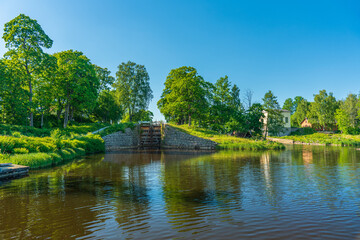 Fototapeta na wymiar Canal lock and power station at the Stromsholms canal in Fagersta, Sweden