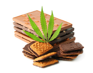 Chocolate bars and biscuits close-up with hemp leaf on white isolated background. Chocolate marijuana dessert cookies with CBD cannabis