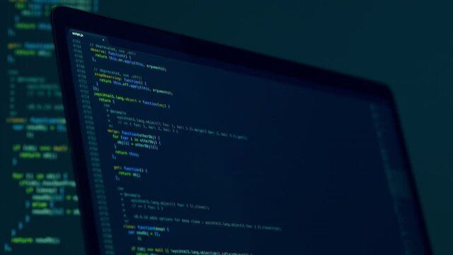 Real Javascript code. Front end web development. Java script JS code on laptop screen. Web design concept.