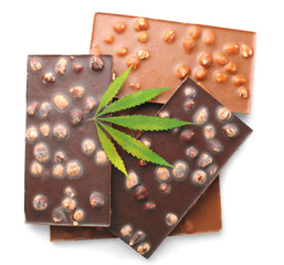 Delicious chocolate bars with nuts and green hemp leaves, chocolate containing CBD cannabis, isolated white background